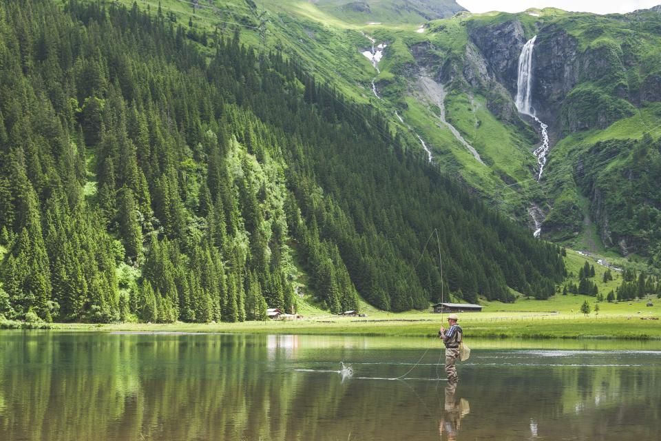 The lake, still, with hills behind